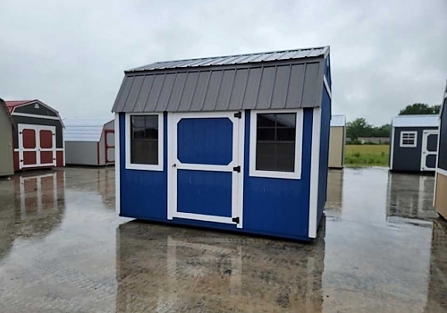 Blue single-door white-trim shed with windows